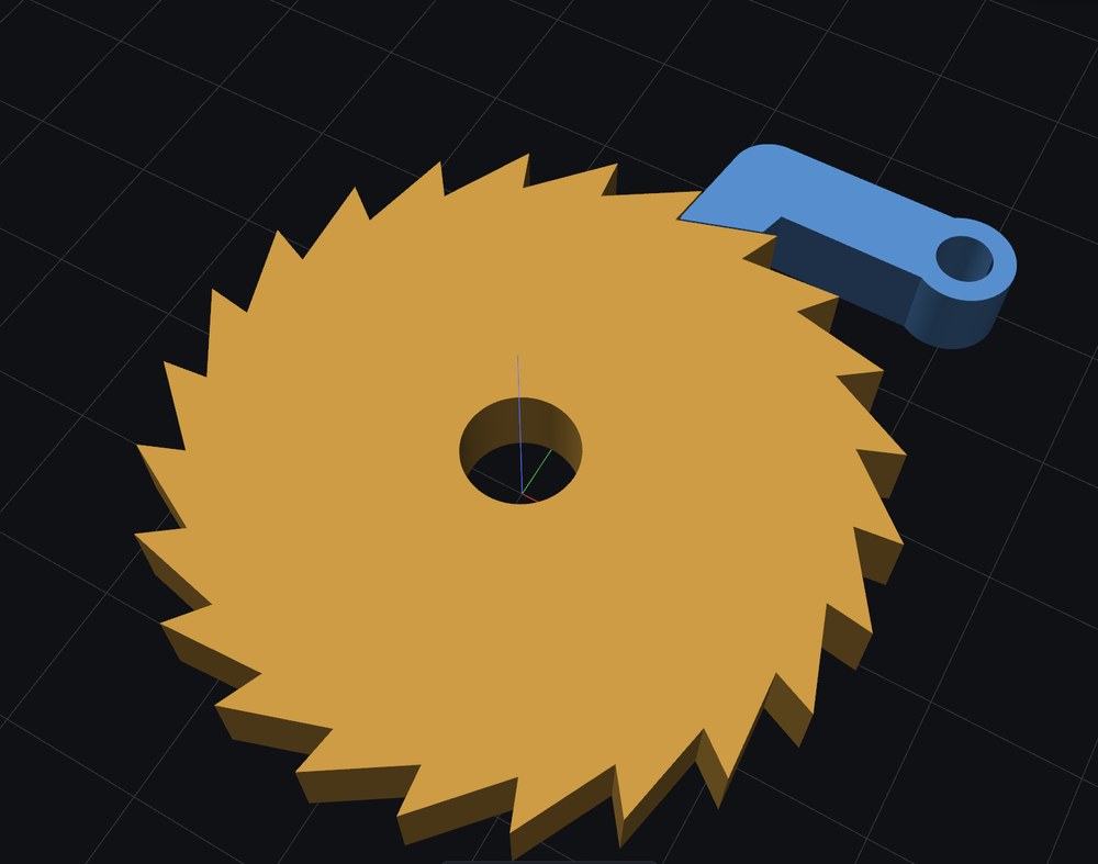 A 24-tooth orange ratchet wheel with a blue pawl resting in its teeth.